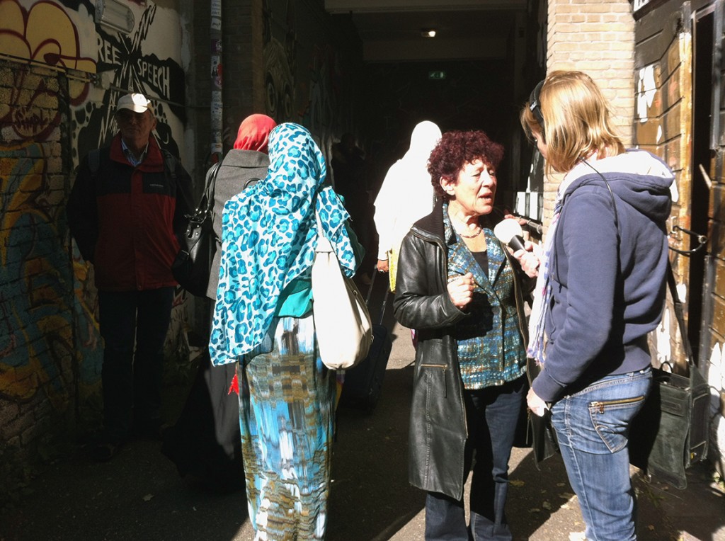 One of the Dutch volunteers talking to a journalist while the refugees were moving from cultural centre OT301 (Overtoom 301, Amsterdam) to De Bron (Hugo de Vrieslaan 2, Amsterdam), a church in Watergraafsmeer where they coud spend the night of 1 Oct. 2013.